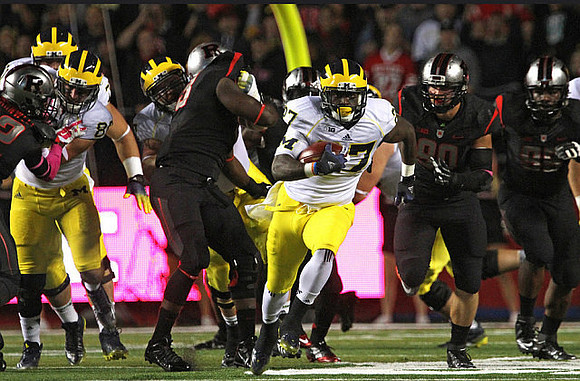 Jake Butt (88) and Derrick Green (27)