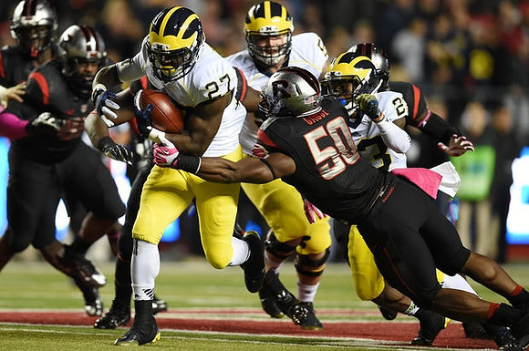 Derrick Green (27), Mason Cole (52), and Dennis Norfleet (23)