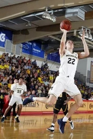 Eli Brooks (55) and Duncan Robinson (22)