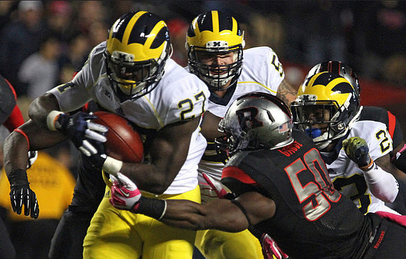 Derrick Green (27), Mason Cole (52), and Dennis Norfleet (23)