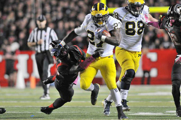 Derrick Green (27) and Jake Butt (88)