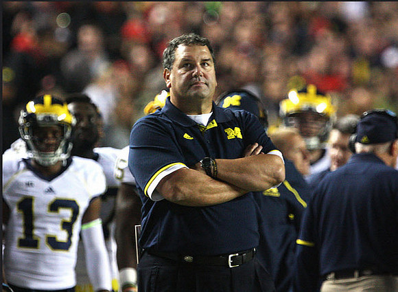 Terry Richardson (13) and Brady Hoke