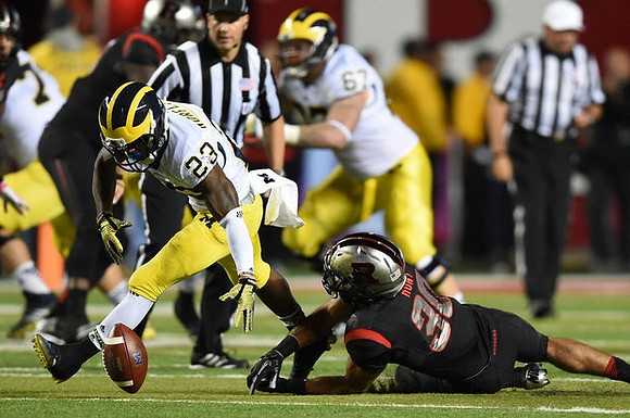 Dennis Norfleet (23) and Kyle Kalis (67)