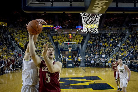 Brandon Johns Jr. (23) and Jon Teske (15)