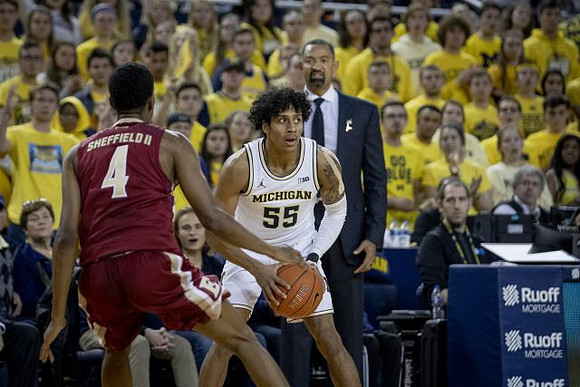 Eli Brooks (55) and Juwan Howard