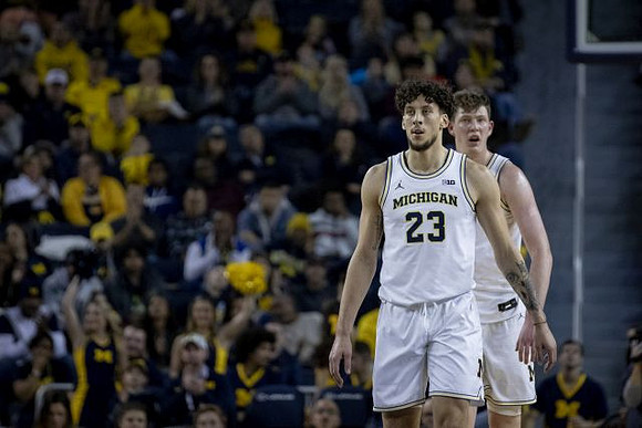 Brandon Johns Jr. (23) and Jon Teske (15)