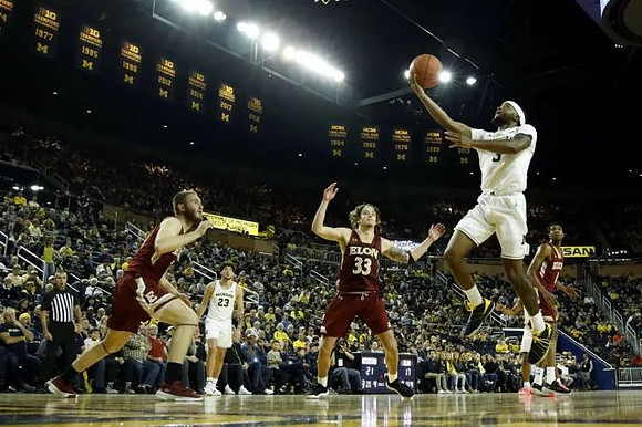 Zavier Simpson (3) and Brandon Johns Jr. (23)