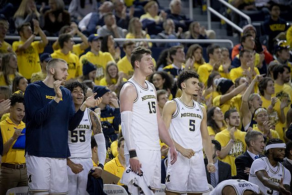 Austin Davis (51), Eli Brooks (55), Jon Teske (15), Adrien Nunez (5), Isaiah Livers (2), and Zavier Simpson (3)