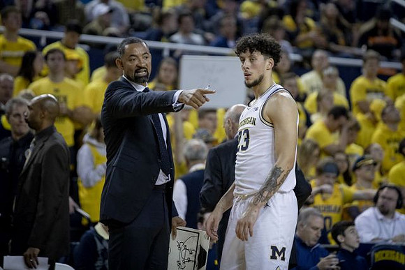 Saddi Washington, Juwan Howard, and Brandon Johns Jr. (23)