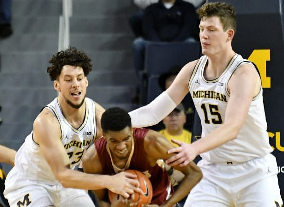 Brandon Johns Jr. (23) and Jon Teske (15)