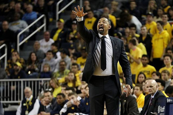 Juwan Howard and Phil Martelli