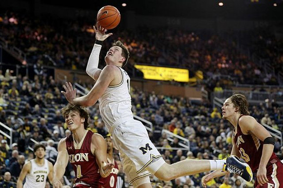 Brandon Johns Jr. (23) and Jon Teske (15)
