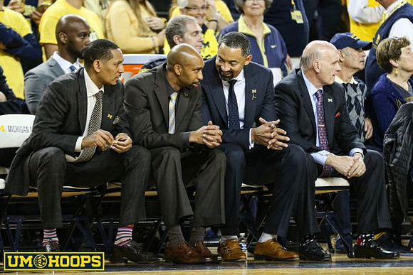 Howard Eisley, Saddi Washington, Juwan Howard, and Phil Martelli