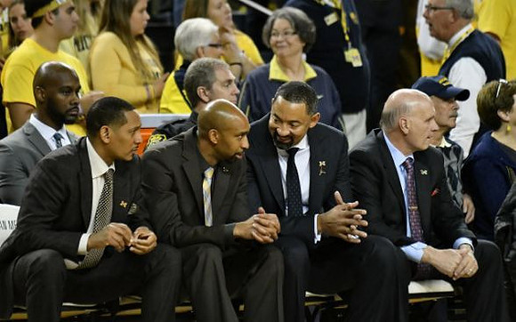 Howard Eisley, Saddi Washington, Juwan Howard, and Phil Martelli