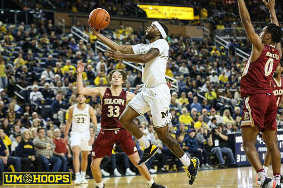 Zavier Simpson (3) and Brandon Johns Jr. (23)