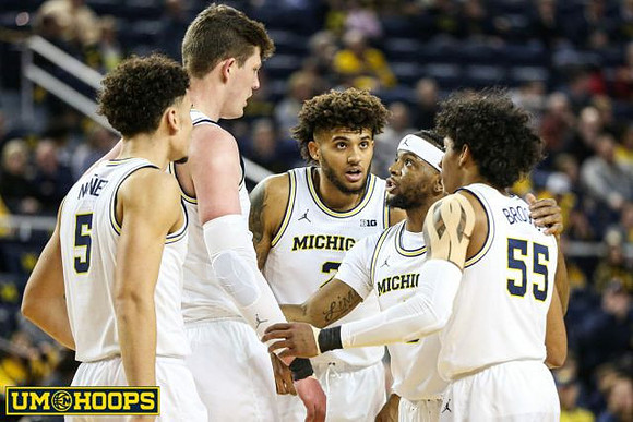 Adrien Nunez (5), Jon Teske (15), Isaiah Livers (2), Zavier Simpson (3), and Eli Brooks (55)