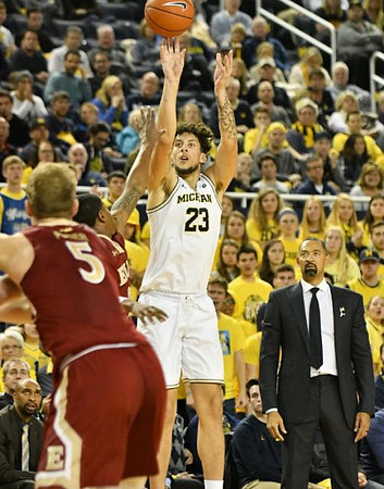 Brandon Johns Jr. (23) and Juwan Howard