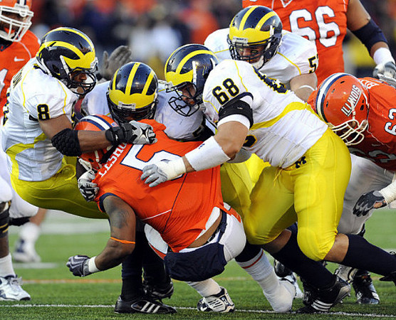 Jonas Mouton (8), Brandon Graham (55), Mike Martin (68), and Ryan Van Bergen (53)