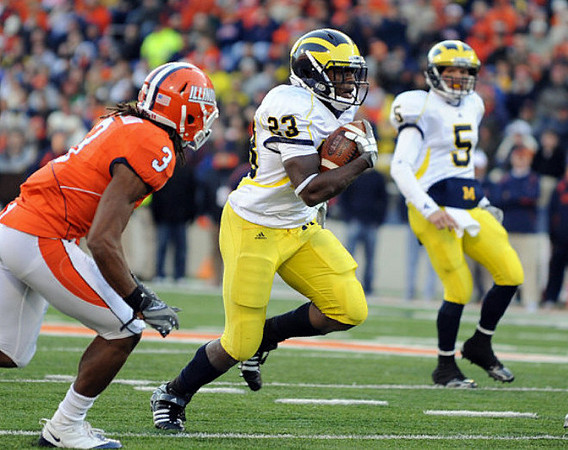 Carlos Brown (23) and Tate Forcier (5)
