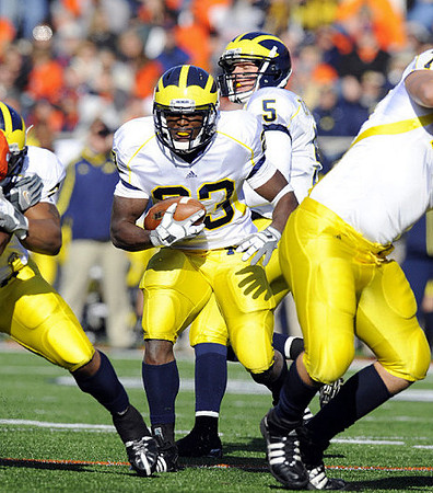 Carlos Brown (23) and Tate Forcier (5)
