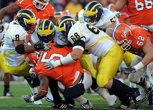 Jonas Mouton (8), Brandon Graham (55), Mike Martin (68), and Ryan Van Bergen (53)