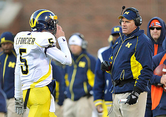 Tate Forcier (5) and Rich Rodriguez