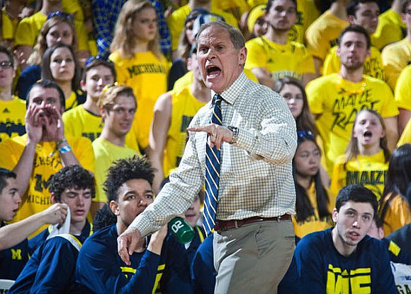 John Beilein, D.J. Wilson (5), and Sean Lonergan (20)