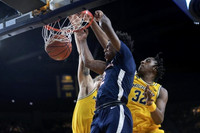 Joey Baker (15) and Tarris Reed Jr. (32)