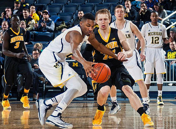 Zak Irvin (21), Spike Albrecht (2), and Muhammad-Ali Abdur-Rahkman (12)