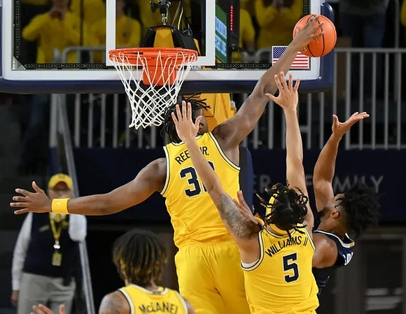 Dug McDaniel (0), Tarris Reed Jr. (32), and Terrance Williams II (5)