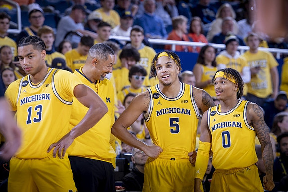 Jett Howard (13), Juwan Howard, Terrance Williams II (5), and Dug McDaniel (0)