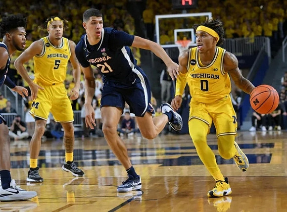 Terrance Williams II (5) and Dug McDaniel (0)