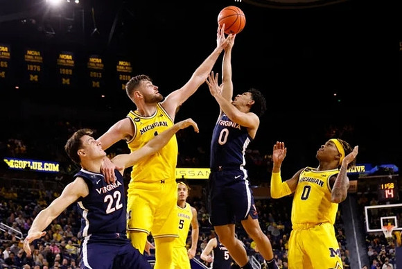 Hunter Dickinson (1), Dug McDaniel (0), and Terrance Williams II (5)