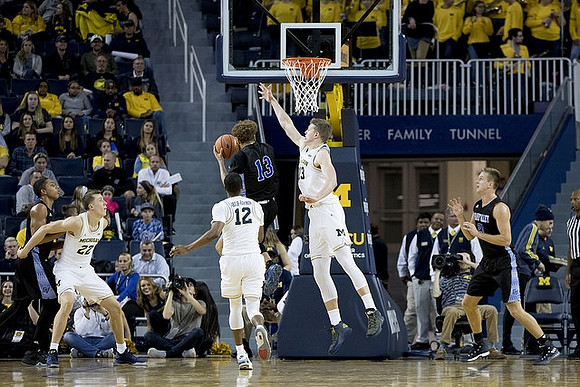 Duncan Robinson (22), Muhammad-Ali Abdur-Rahkman (12), and Moritz Wagner (13)