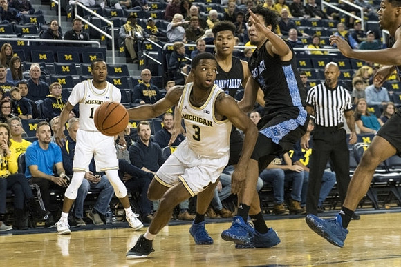 Muhammad-Ali Abdur-Rahkman (12) and Zavier Simpson (3)