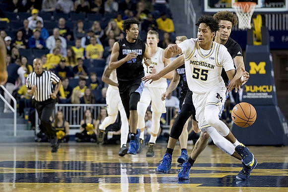 Eli Brooks (55) and Moritz Wagner (13)