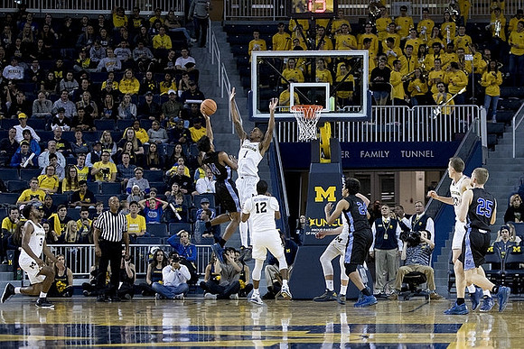 Zavier Simpson (3), Charles Matthews (1), Muhammad-Ali Abdur-Rahkman (12), and Duncan Robinson (22)
