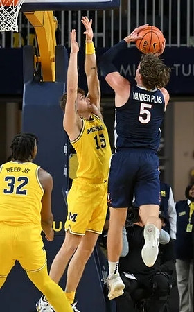 Tarris Reed Jr. (32) and Joey Baker (15)