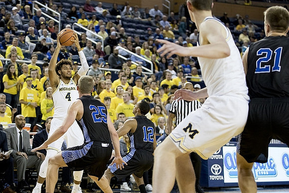 Isaiah Livers (4) and Jon Teske (15)