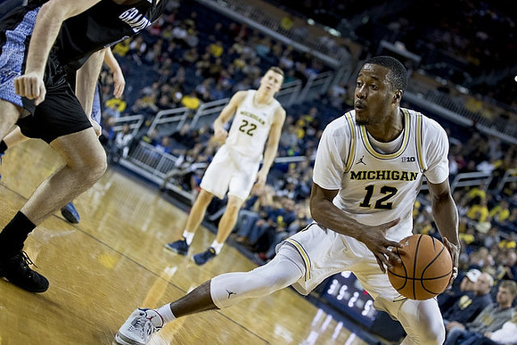 Duncan Robinson (22) and Muhammad-Ali Abdur-Rahkman (12)