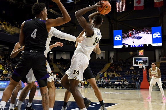 Moussa Diabate (14) and Eli Brooks (55)