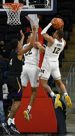 Caleb Houstan (22) and DeVante' Jones (12)