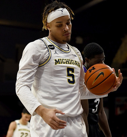 Terrance Williams II (5) and Caleb Houstan (22)