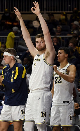Will Tschetter (42), Hunter Dickinson (1), and Caleb Houstan (22)