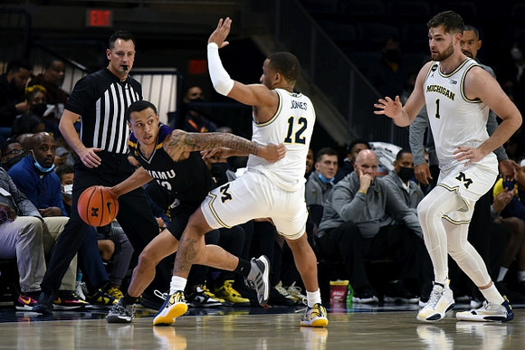DeVante' Jones (12) and Hunter Dickinson (1)