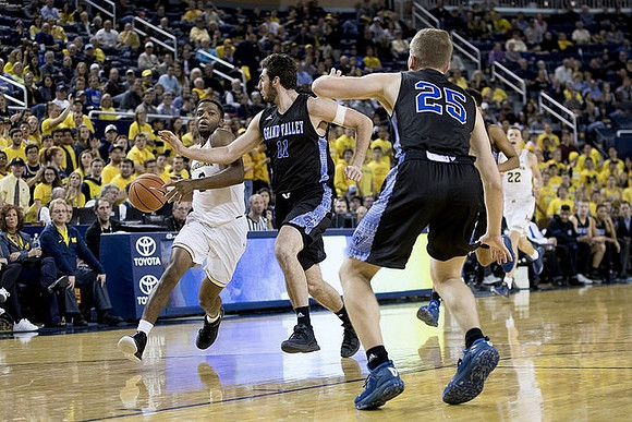 Zavier Simpson (3) and Duncan Robinson (22)
