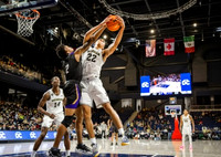 Moussa Diabate (14), Caleb Houstan (22), and Eli Brooks (55)