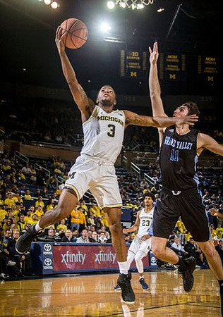 Zavier Simpson (3) and Ibi Watson (23)