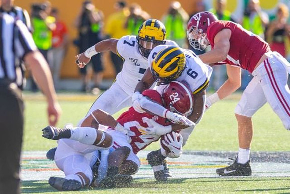 Josh Uche (6) and Khaleke Hudson (7)