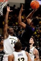 Moussa Diabate (14), DeVante' Jones (12), and Brandon Johns Jr. (23)